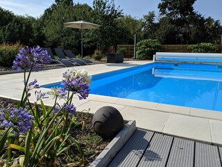 Pool with solar shower