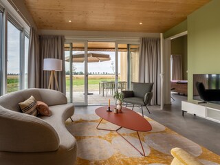 Living room with door to bedroom