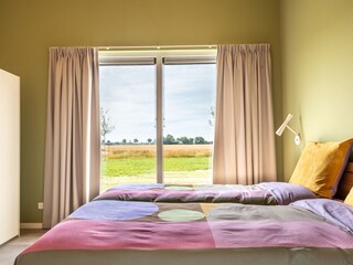 Master bedroom with view on fields