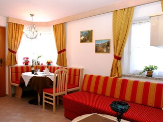 ChatGPT:  Bright and cozy open-plan kitchen with inviti