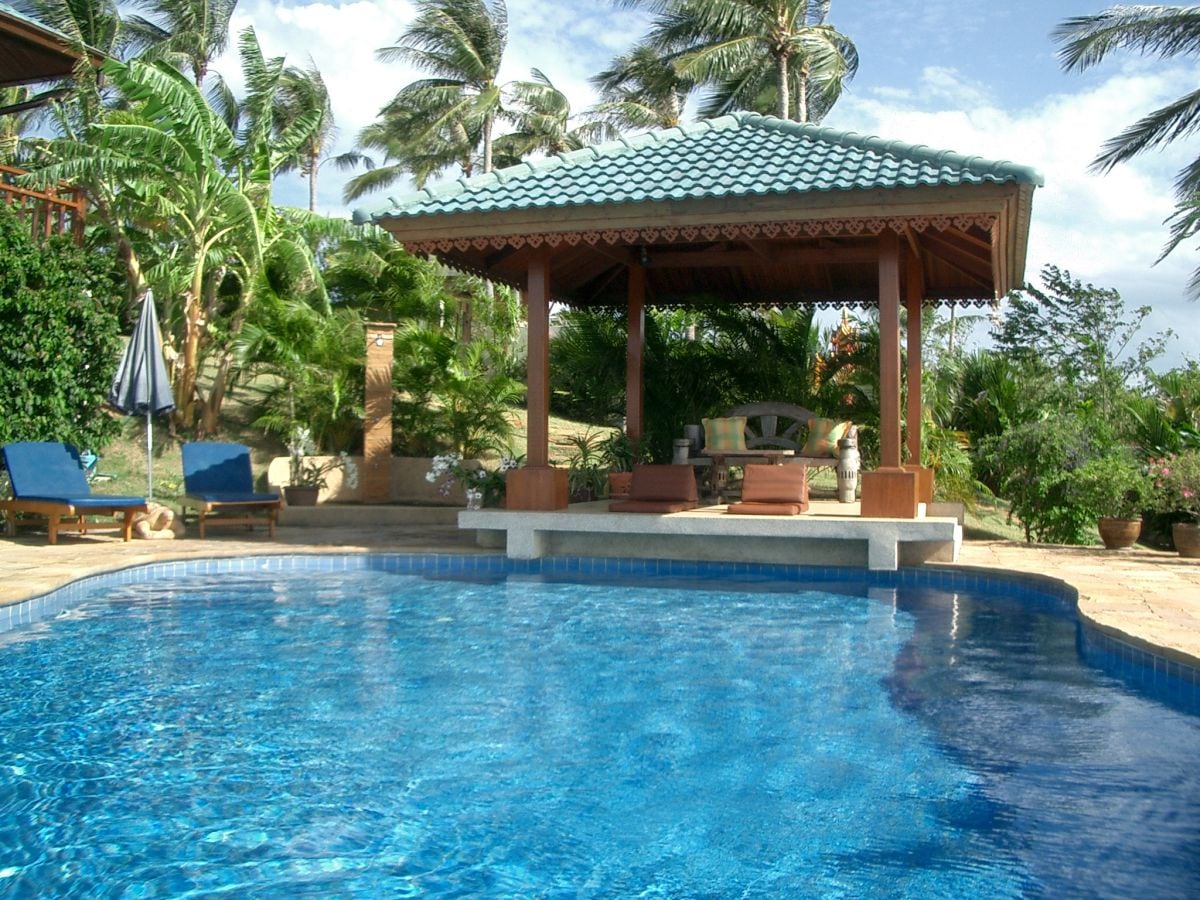 Large private pool with loungers and a sala (open pavilion)