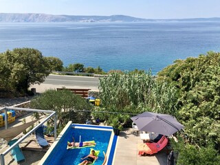 Pool area and sea view with island Krk behind,