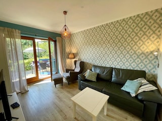 Wohnzimmer mit Schlafsofa