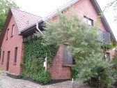 Entrance, covered by a tree