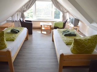 Schalfzimmer im Spitzboden mit herrlichem Blick