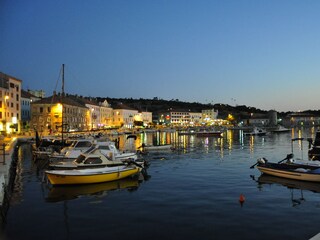 Senj and harbor at night