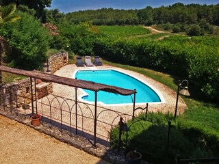 Terrace and pool amidst hills