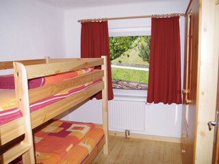 a bedroom with bunkbed