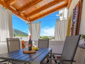 Two bedroom apartment near beach Nerezine, Lošinj A-7963-a