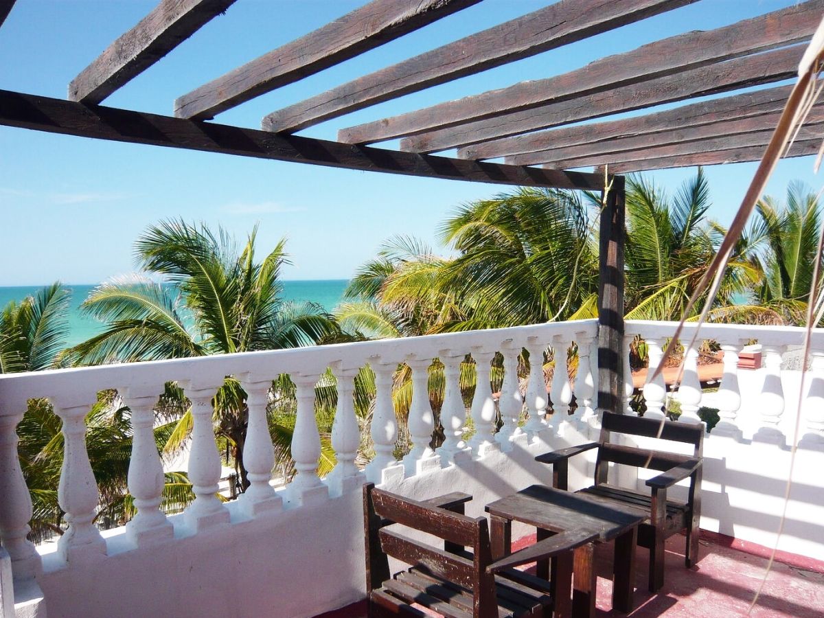 View on the Palm trees, beach and Ocean Casa Maya Lodge