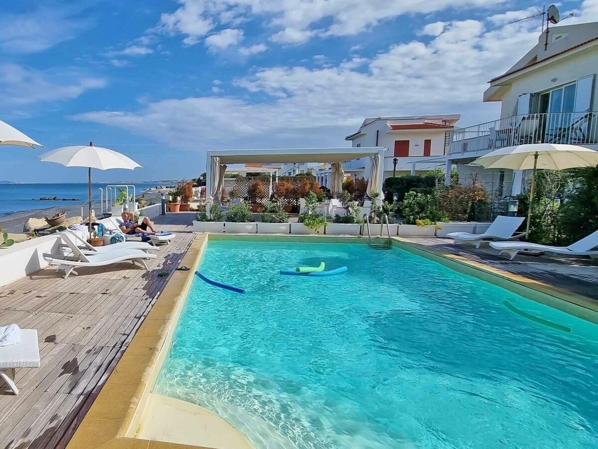 The pool directly at the beach of the apartment