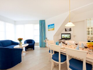 bright, large living room with view to balcony