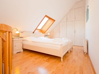 bright and ample bedroom3 with a big wardrobe