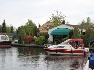 Holiday house with boat and own landing stage