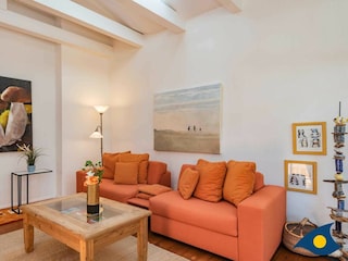 Wohnzimmer mit Zugang zur Verranda und Terrasse