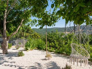 Garden in a flower landscape with a swing