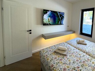 The three bedrooms, each featuring a king-size bed