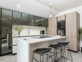 modern appliances like an espresso machine, dishwasher.