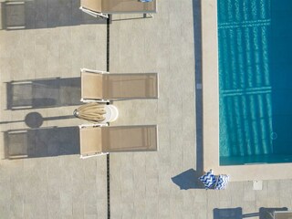 sparkling 41m² pool with ten sun loungers