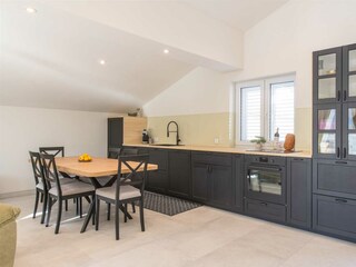 Second fully equipped kitchen with modern appliances