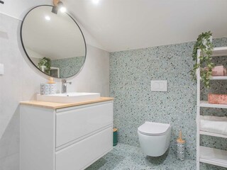 This level also features a bathroom with a shower.