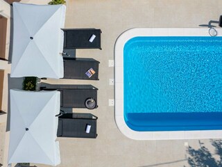 2 parasols, 4 sun loungers, outside shower.