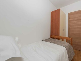 The third bedroom includes a 90x200 cm single bed