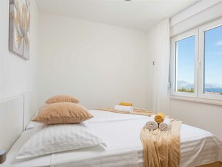 The third upstairs bedroom includes two single beds.