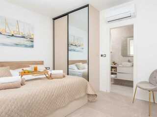 King-size bed (180x200 cm) and its own bathroom.