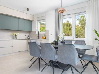 The villa features a sleek, fully equipped kitchen.