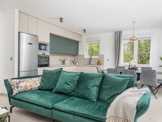 The stylish living room offers a comfortable space.