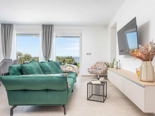 The stylish living room offers a comfortable space