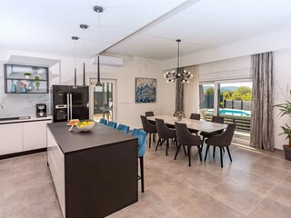 There is a laundry room equipped with a washing machine