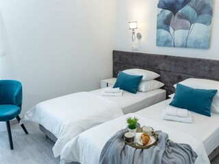 A bed  which can be converted into two single beds.