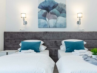 A bed  which can be converted into two single beds.