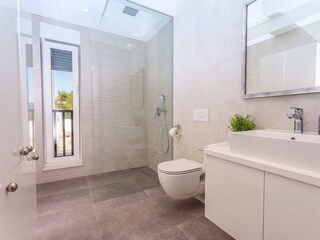 Bathroom with walk in shower.