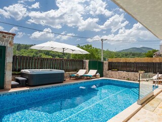 Relax in the outdoor Jacuzzi.