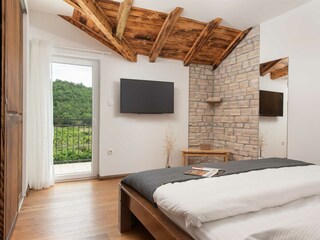 Bedroom 2 also features a queen-size bed