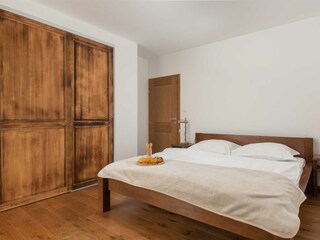 Bedroom 2 also features a queen-size bed