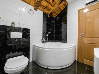 A shared family bathroom with a bathtub