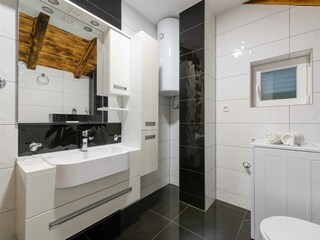 A shared family bathroom with a bathtub