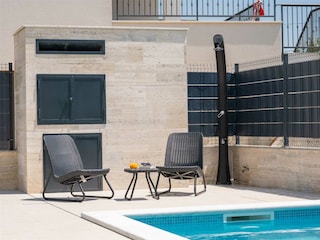 Start your day with a cup of coffee by the pool.