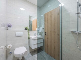 Bedroom No. 2 is enhanced by a stylish walk-in bathroom