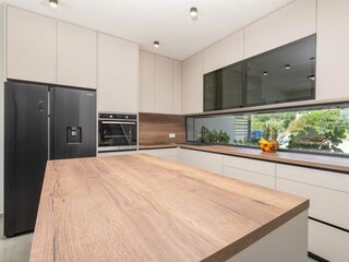 designed in warm beige shades, comes fully equipped