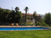 View over the pool with the Manor in the back