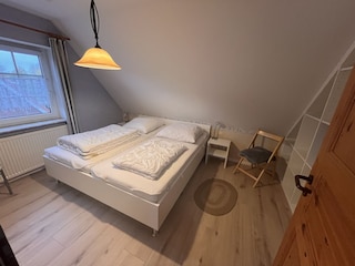Schlafzimmer mit Doppelbett
