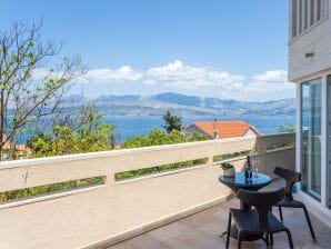 Two bedroom apartment with terrace and sea view Splitska, Brač A-23224-c