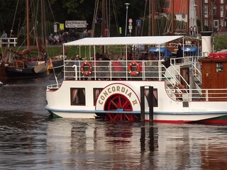 paddle steamer in the harbor Caro