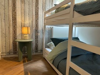 The bunk bed provides two generously sized sleeping spaces.