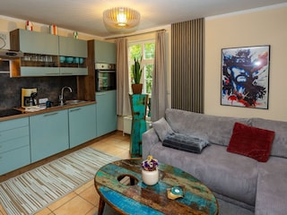 Wohnzimmer mit Küche